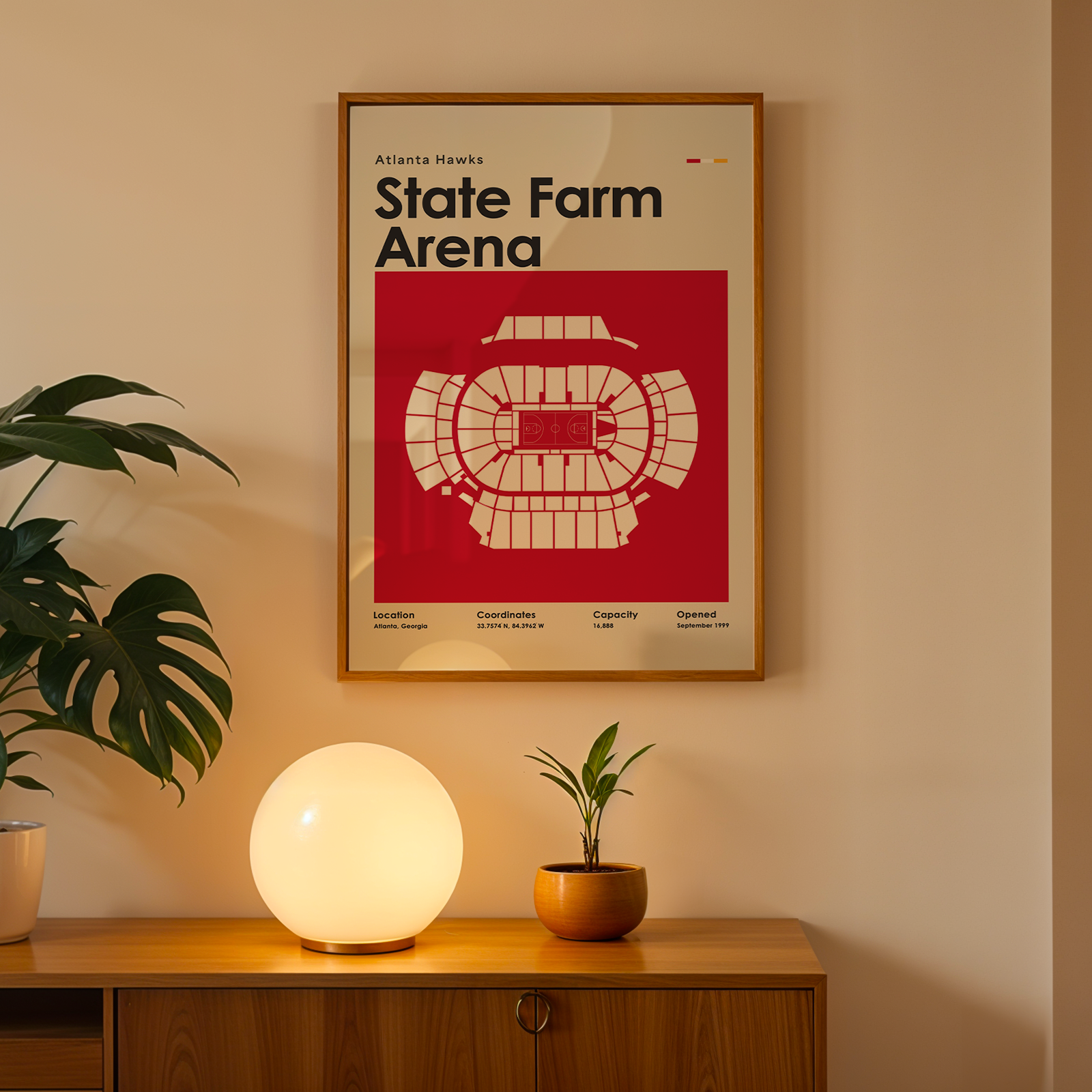 Poster of State Farm Arena on a wall above a wooden cabinet with decorative items.