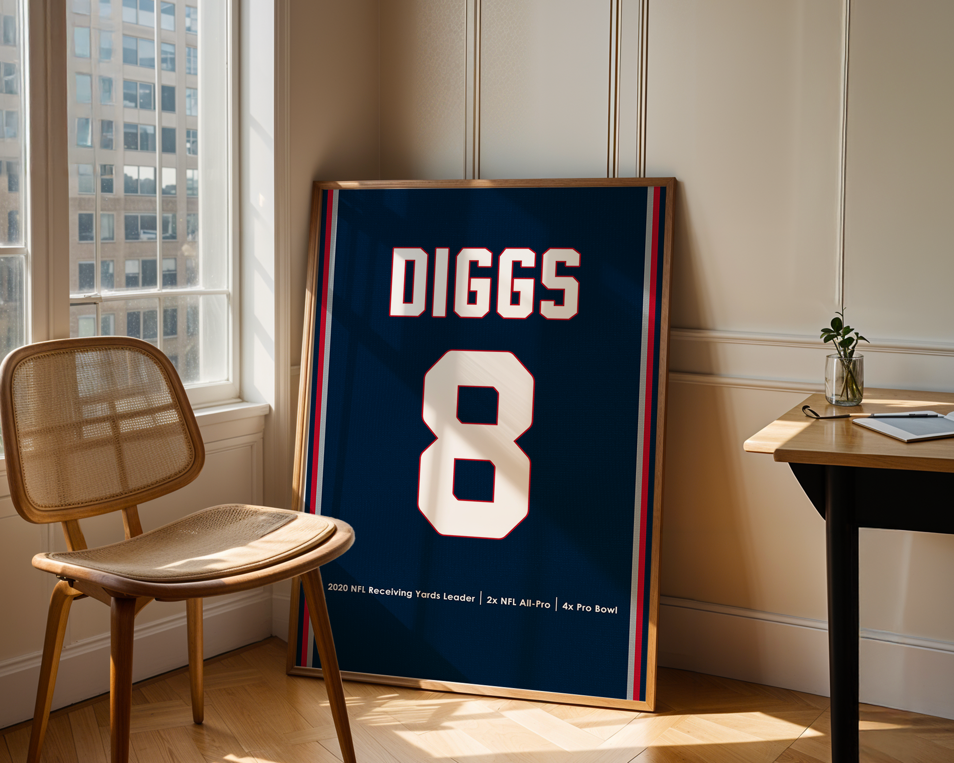 Framed sports jersey with 'DIGGS 8' on a wall in a room with a chair and table.