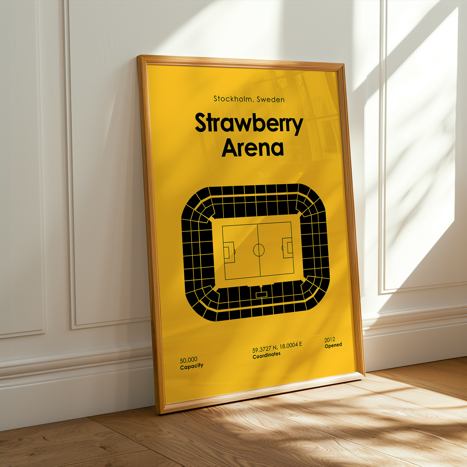 Framed poster of Strawberry Arena with yellow background and wooden frame.