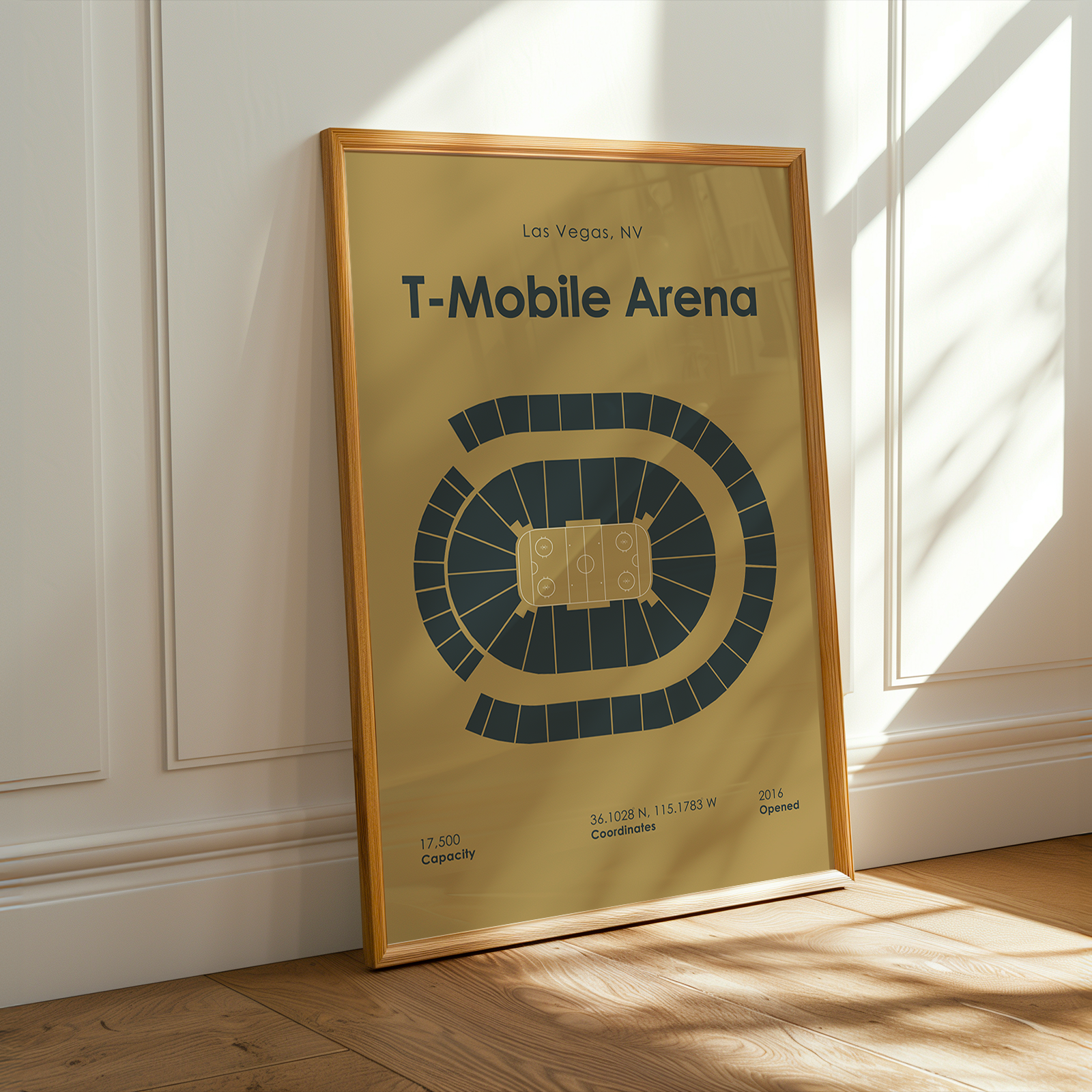 Framed poster of T-Mobile Arena in Las Vegas, NV on a wall.