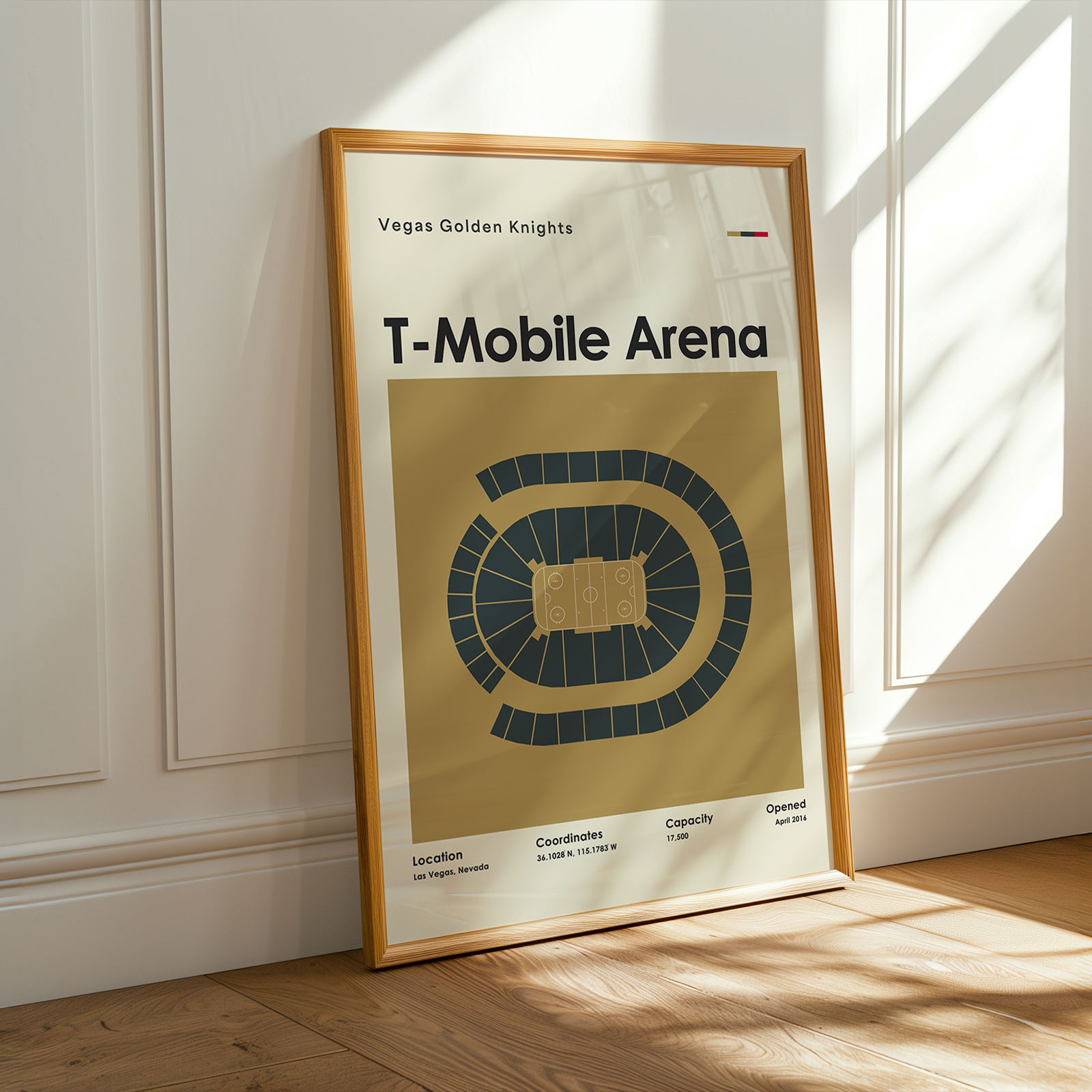 Framed poster of T-Mobile Arena with Vegas Golden Knights branding on a wooden floor.