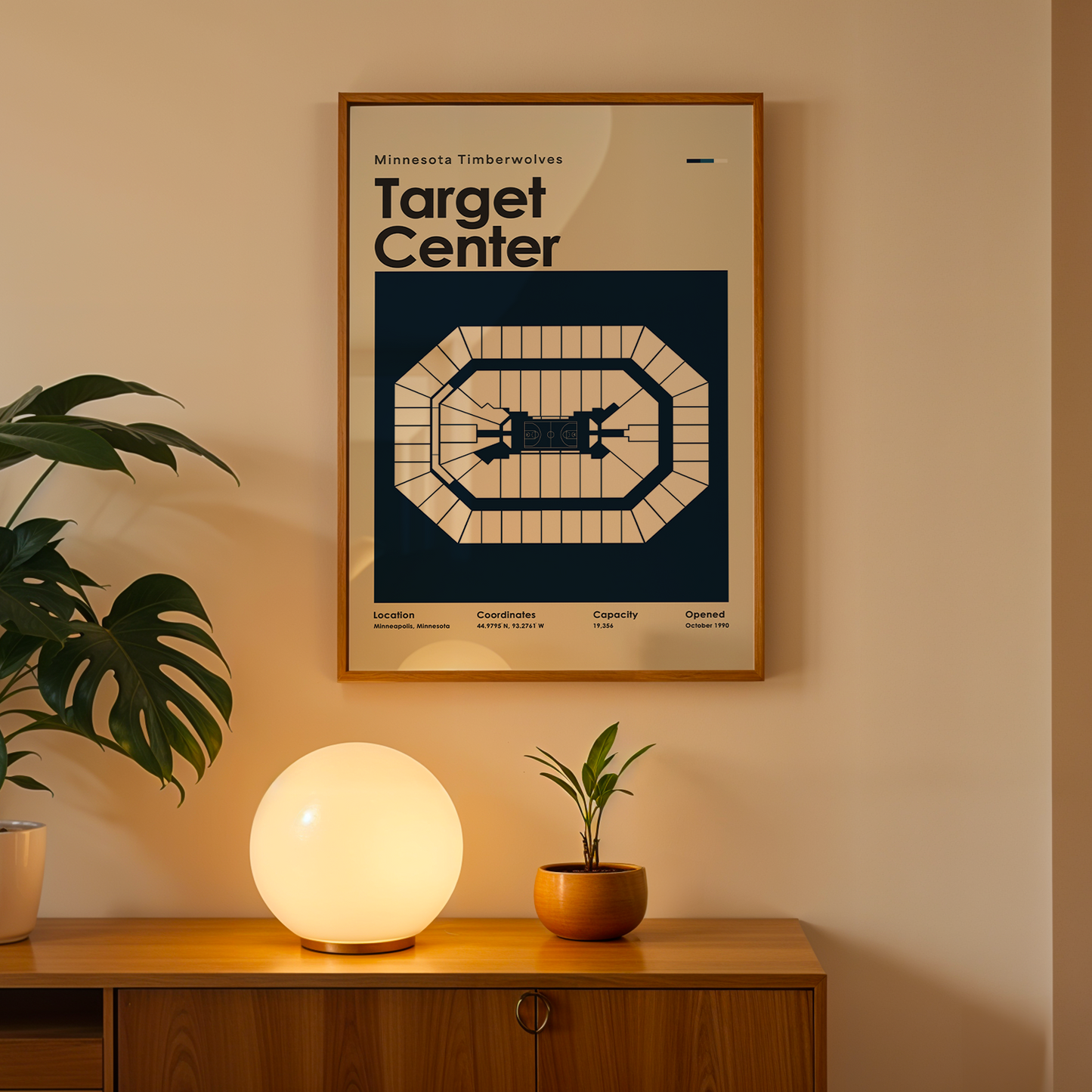 Framed poster of Target Center on a wall above a wooden cabinet with decorative items.