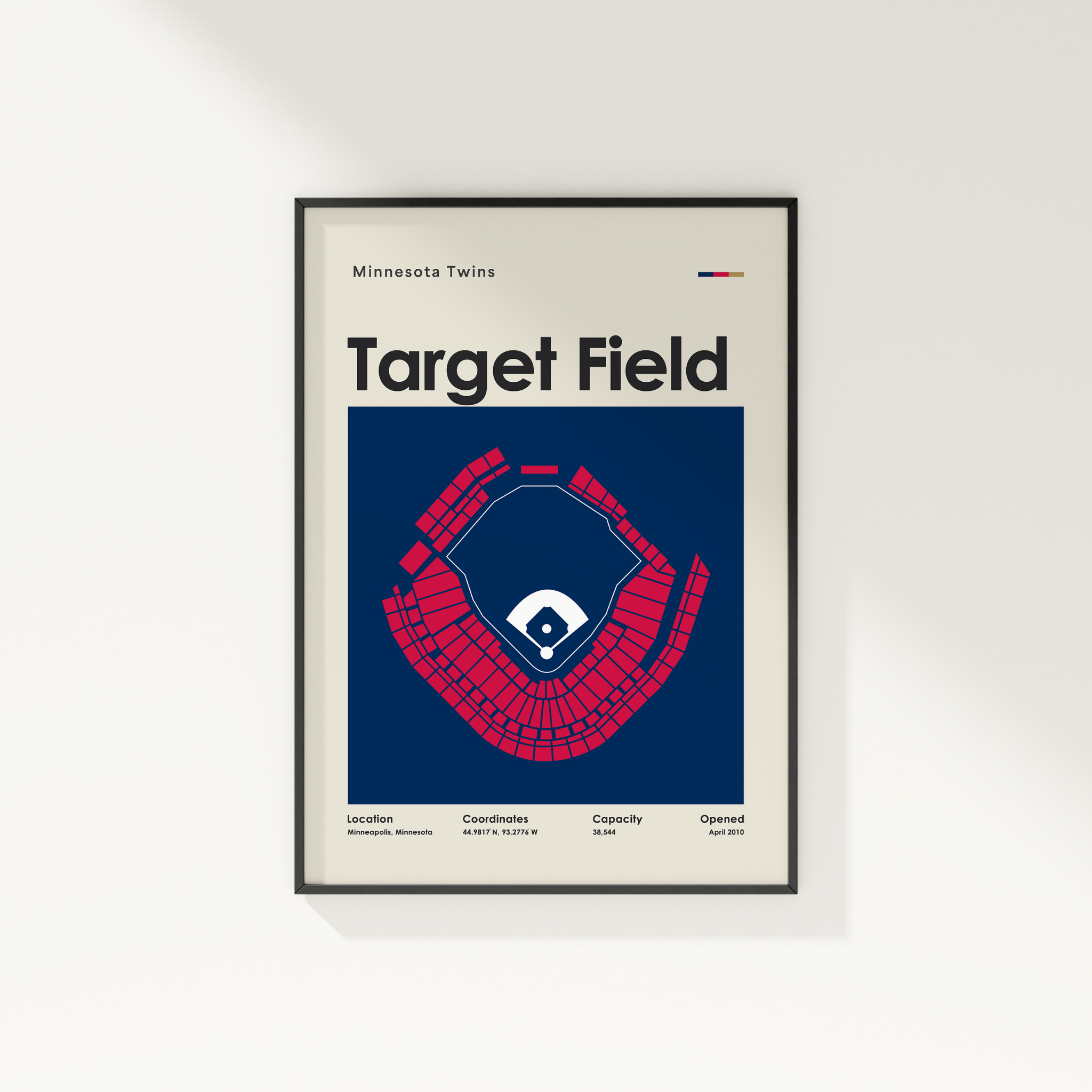 Framed poster of Target Field with Minnesota Twins logo on a white wall