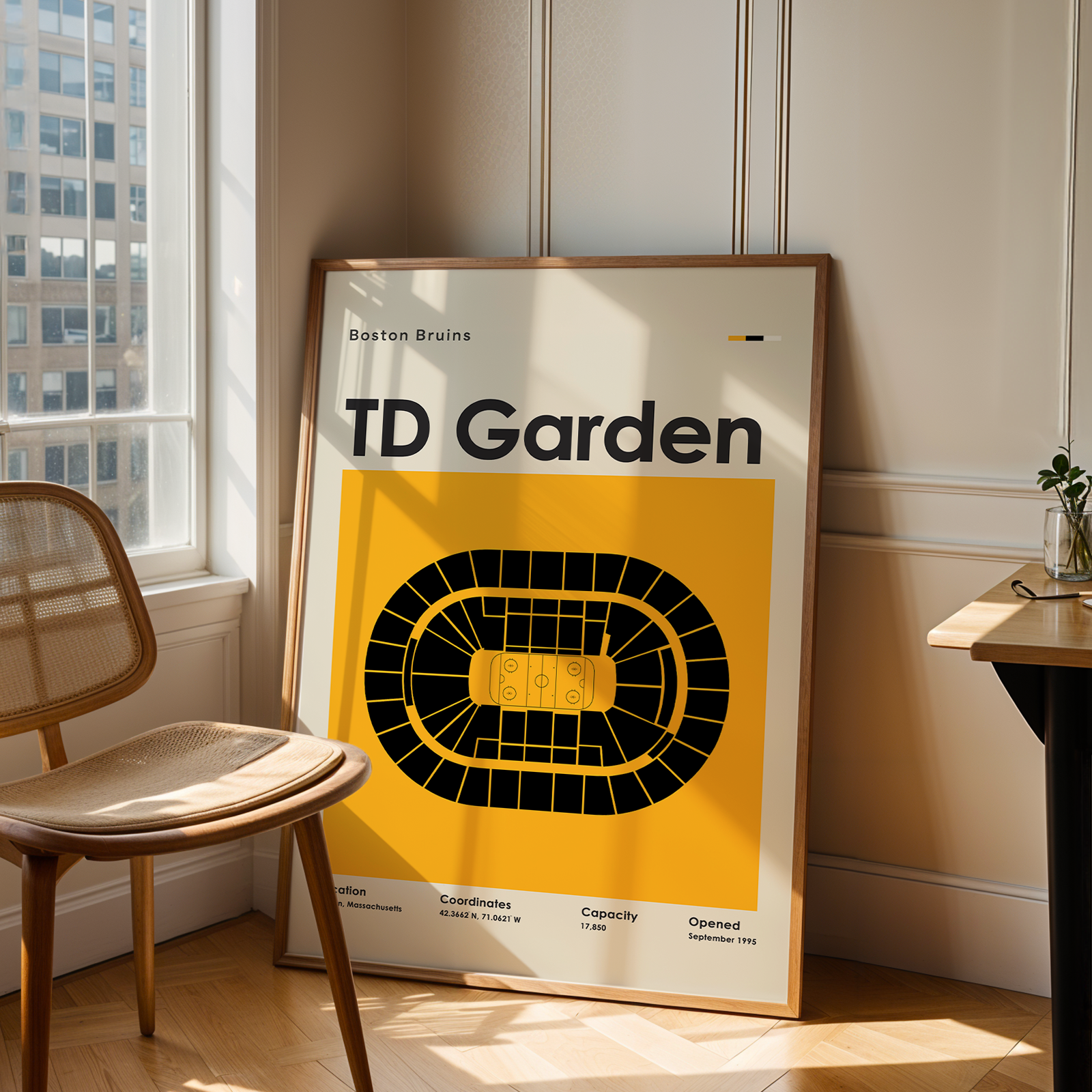 Poster of TD Garden in a room with a chair and table.
