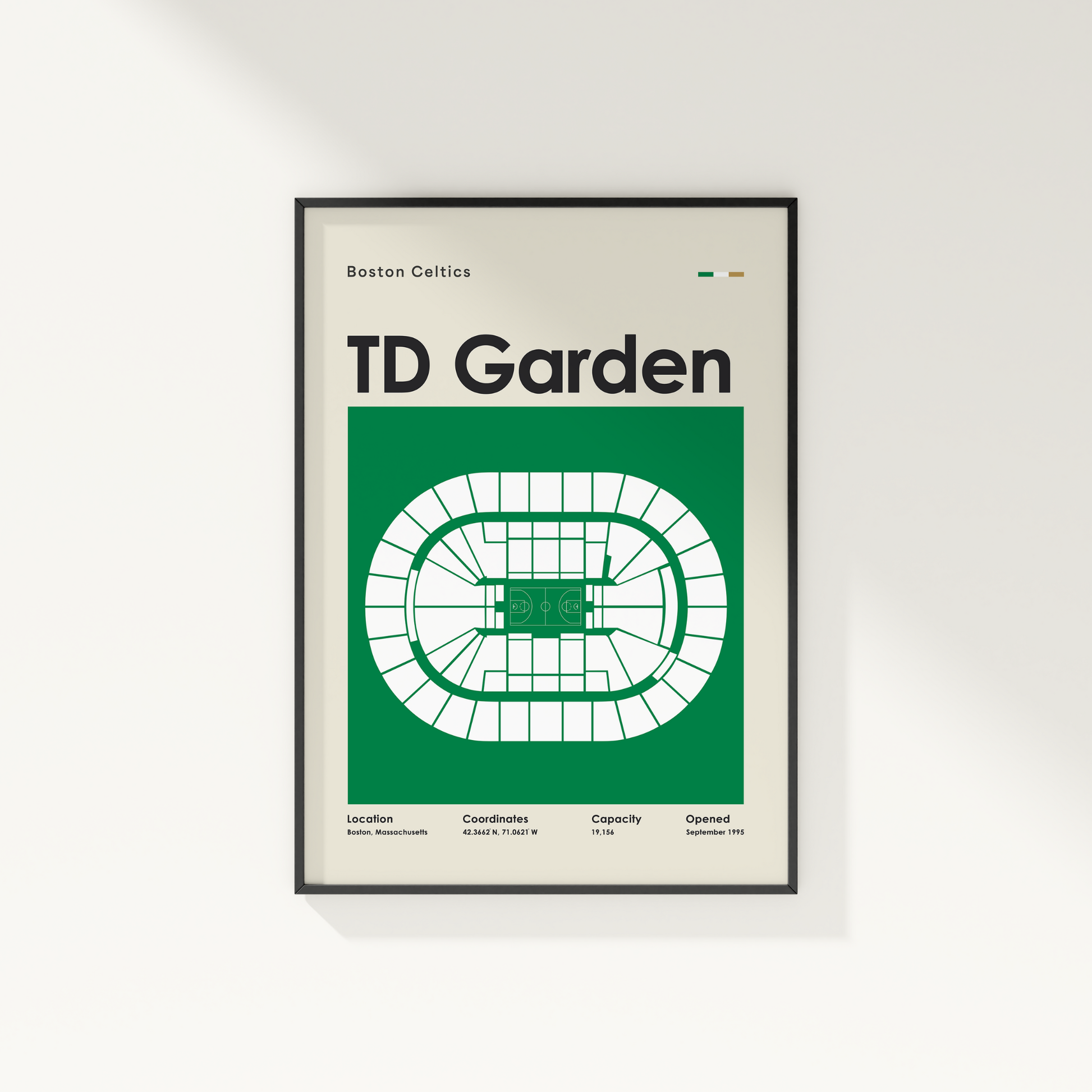 Framed poster of TD Garden layout with Boston Celtics branding on a white wall.