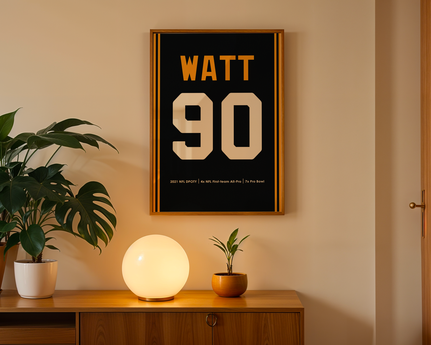 Framed poster with 'WATT 90' on a wall above a wooden cabinet with decorative items.