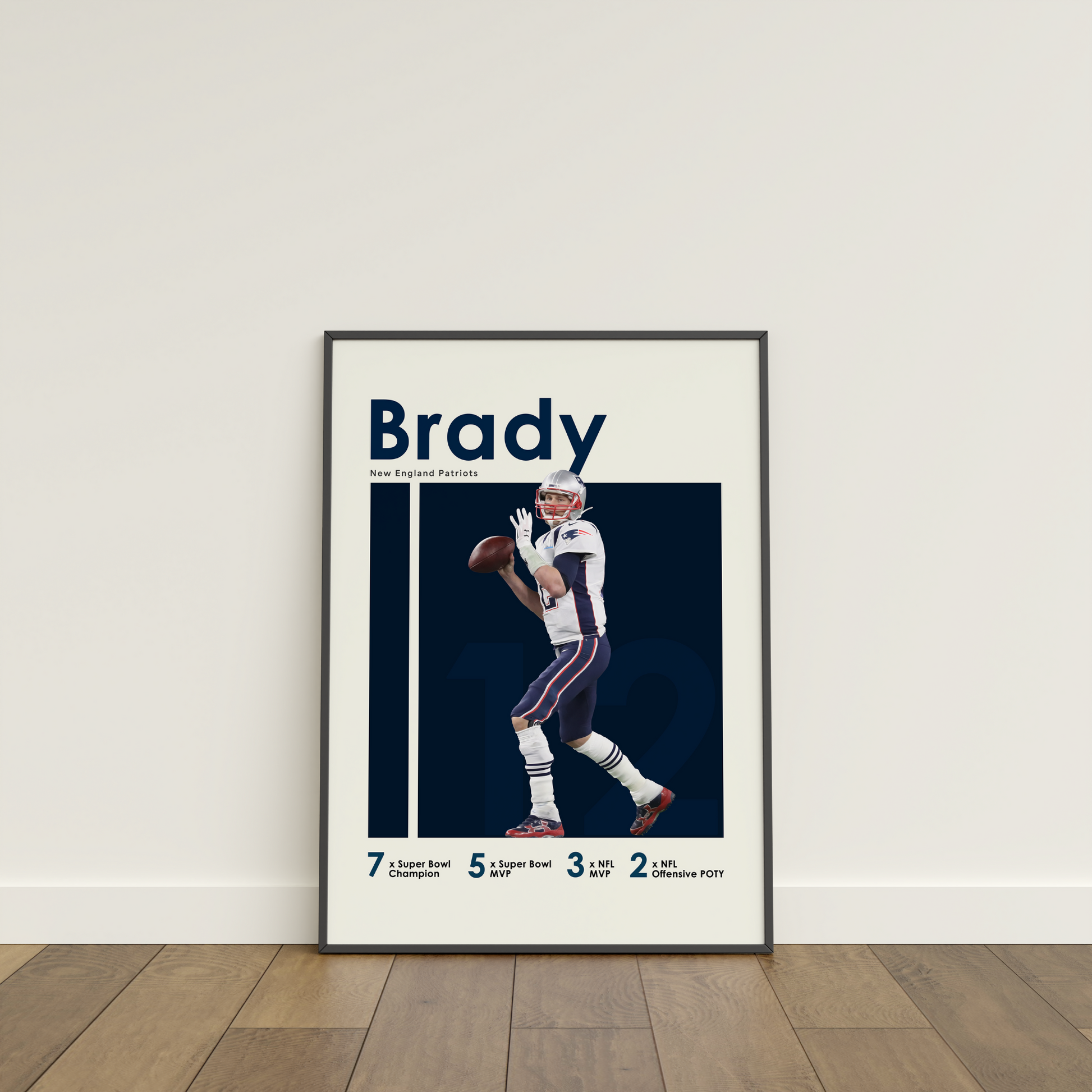 framed poster mockup of football player tom brady leaning on a white wall