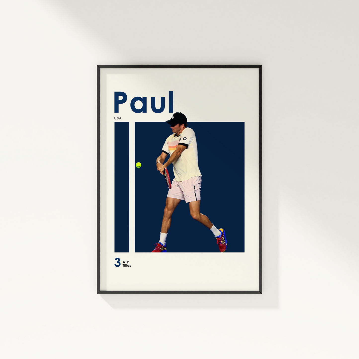 framed poster mockup of tennis player tommy paul hanging on a white wall