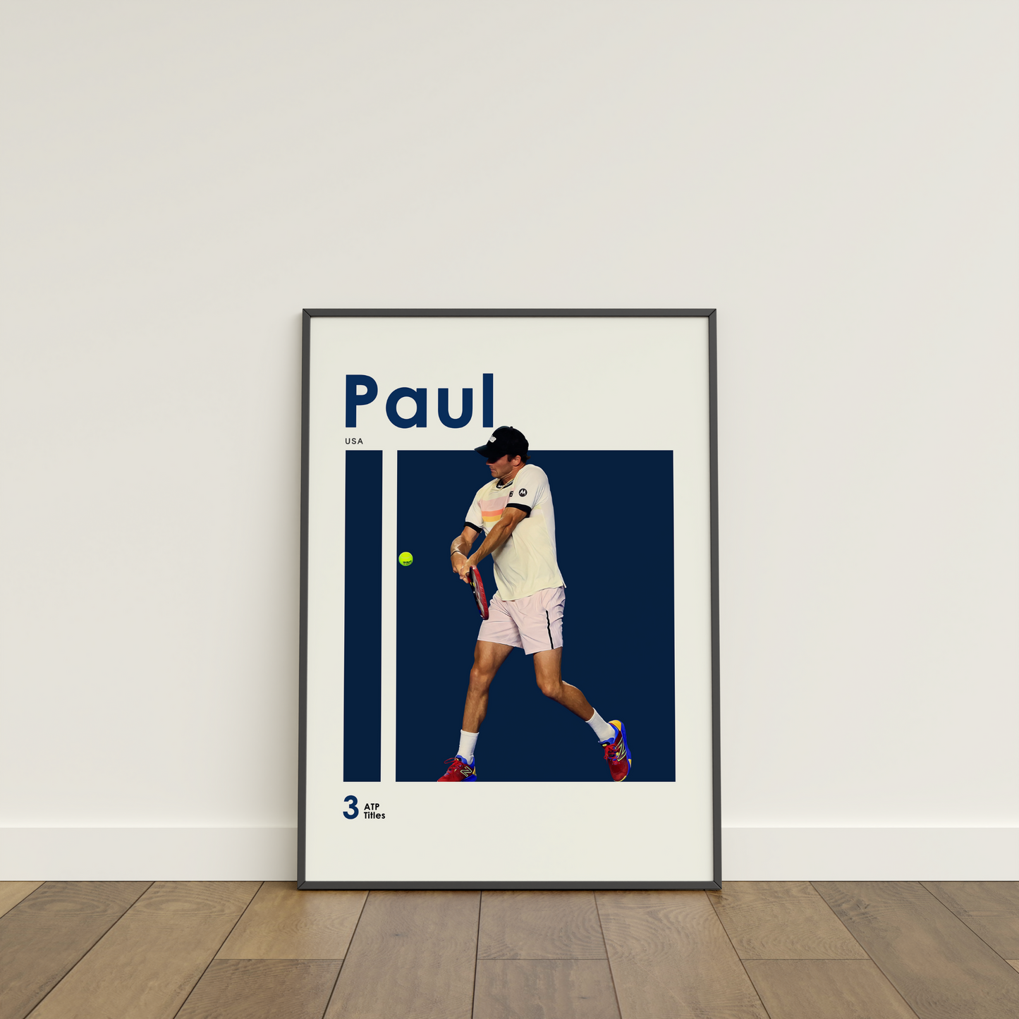 framed poster mockup of tennis player tommy paul leaning on a white wall