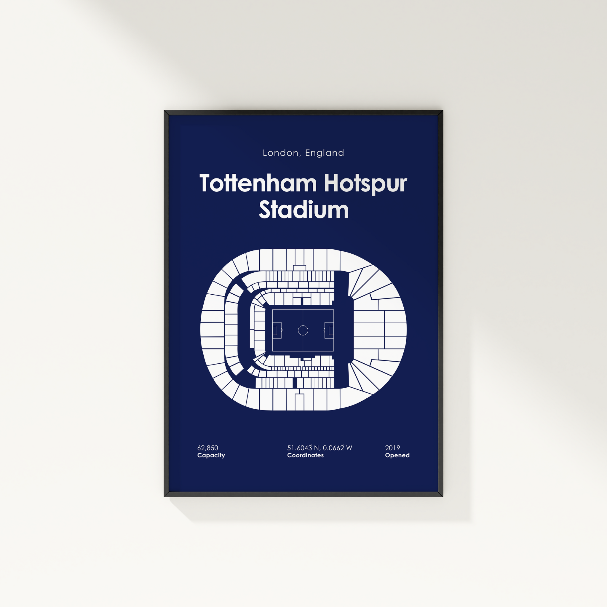 Framed poster of Tottenham Hotspur Stadium layout on a blue background