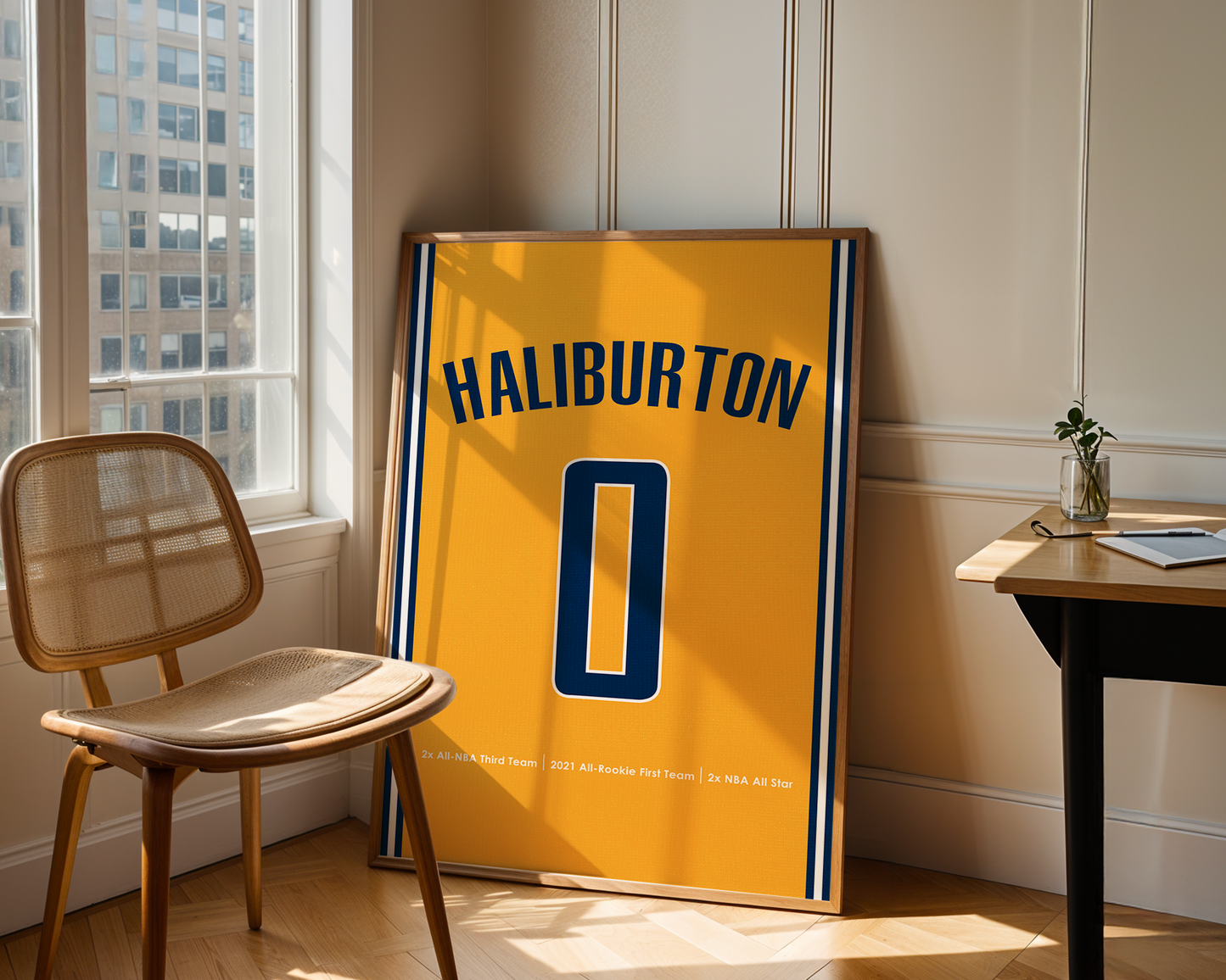 Yellow sports jersey with 'HALIBURTON' and number '0' displayed in a room with a chair and table.