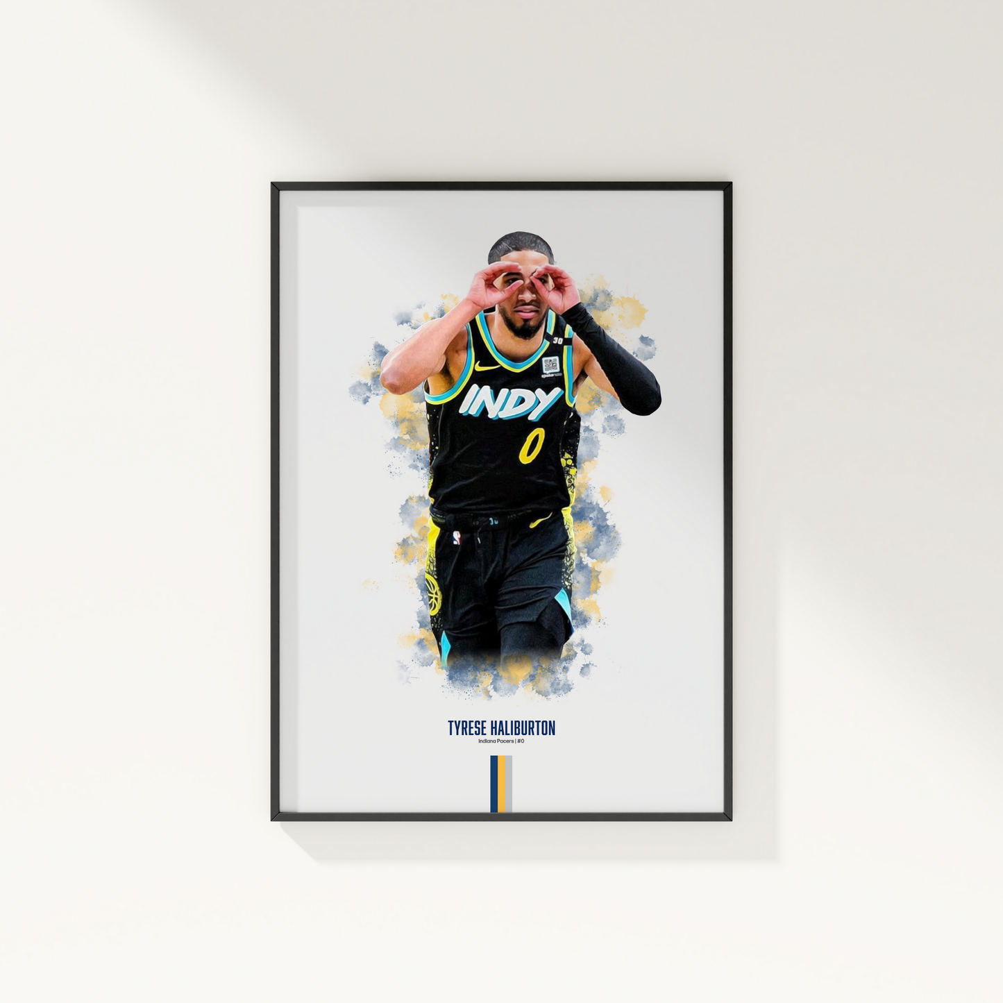 framed poster mockup of basketball player tyrese haliburton hanging on a white wall