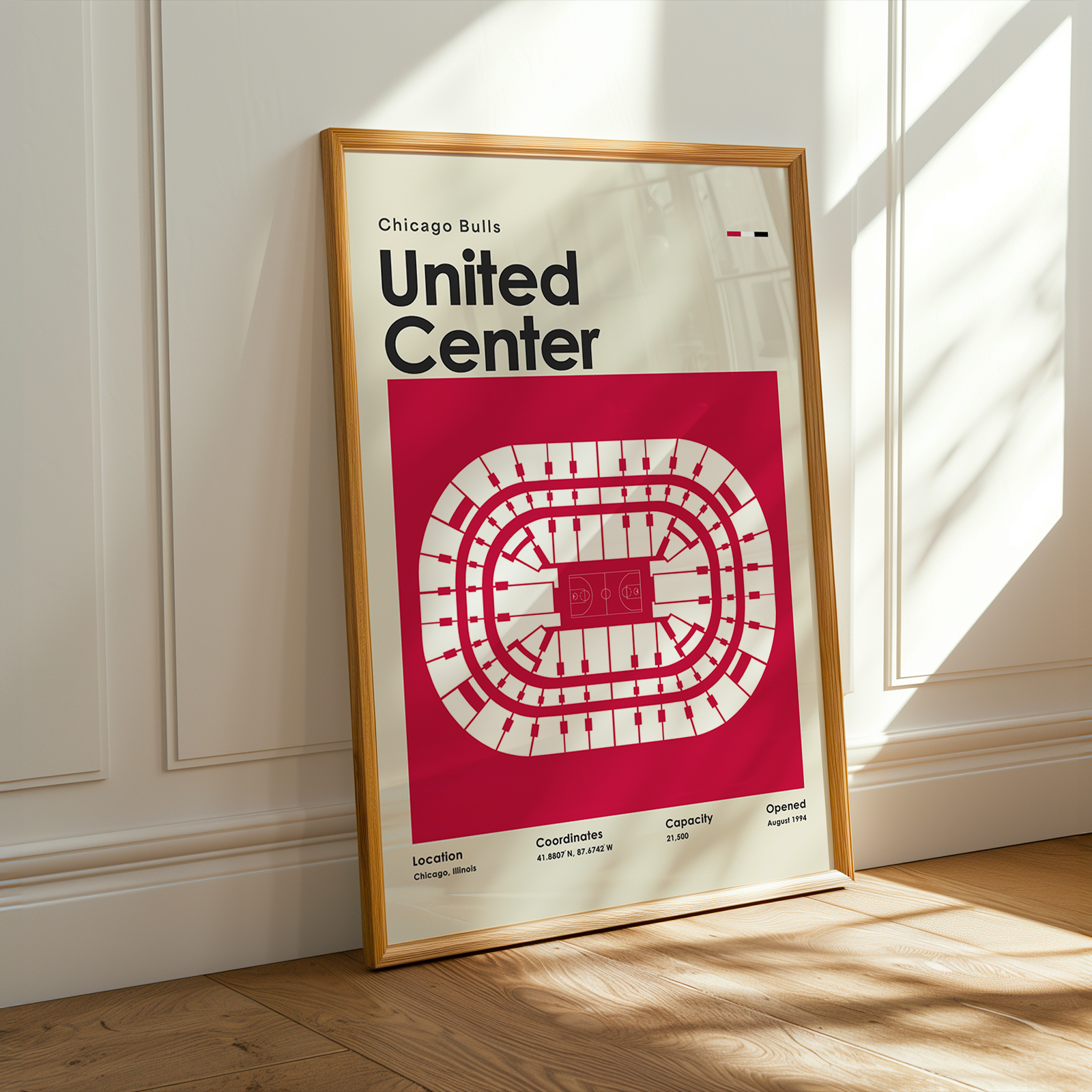Framed poster of the Chicago Bulls United Center layout on a wall.
