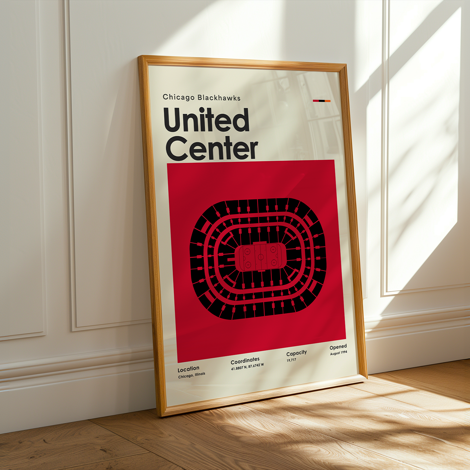 Framed poster of the Chicago Blackhawks United Center layout on a wall.