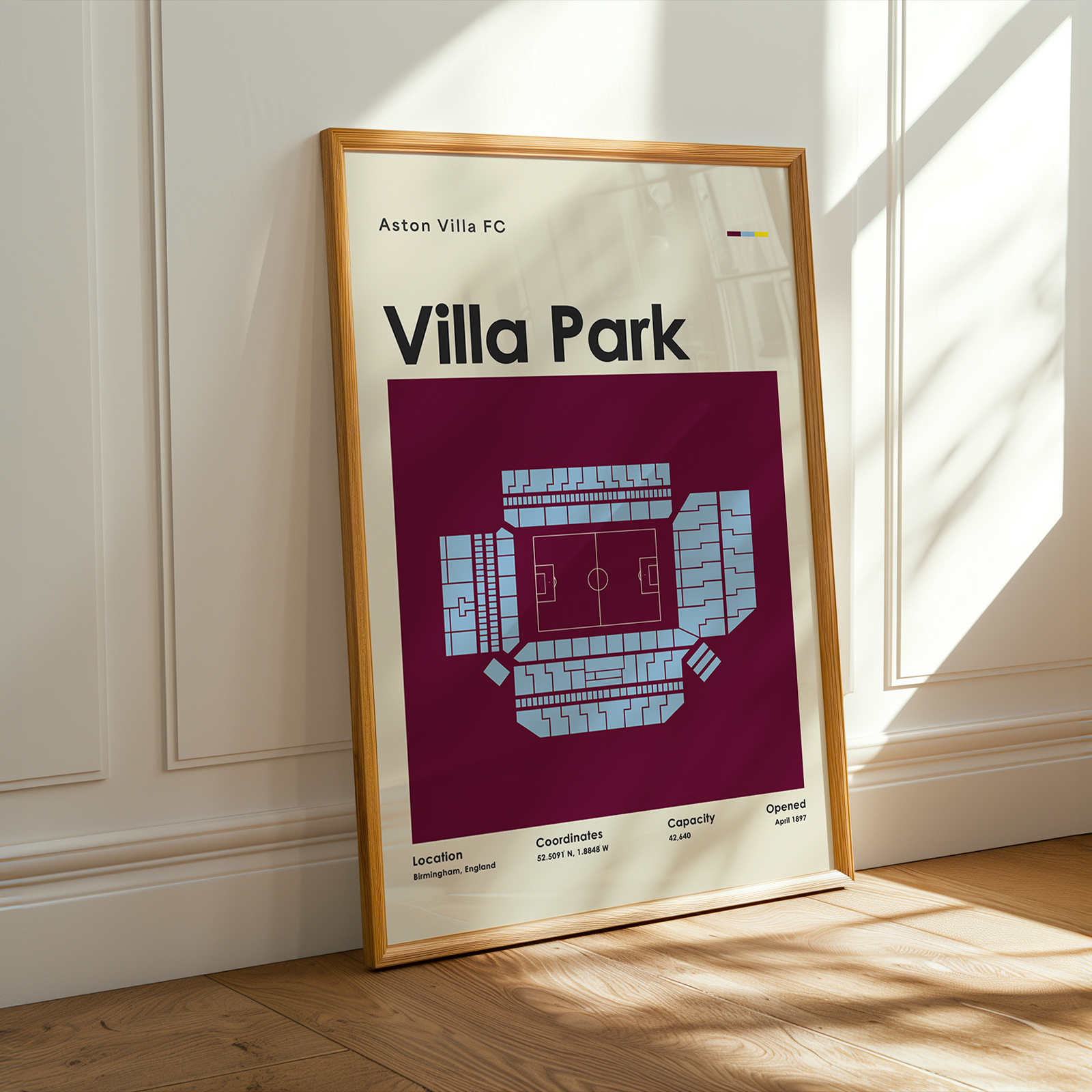 Framed poster of Villa Park stadium layout on a wall.