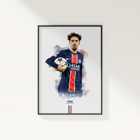 Framed poster print of soccer player Vitinha, wearing a PSG jersey, on a white wall.