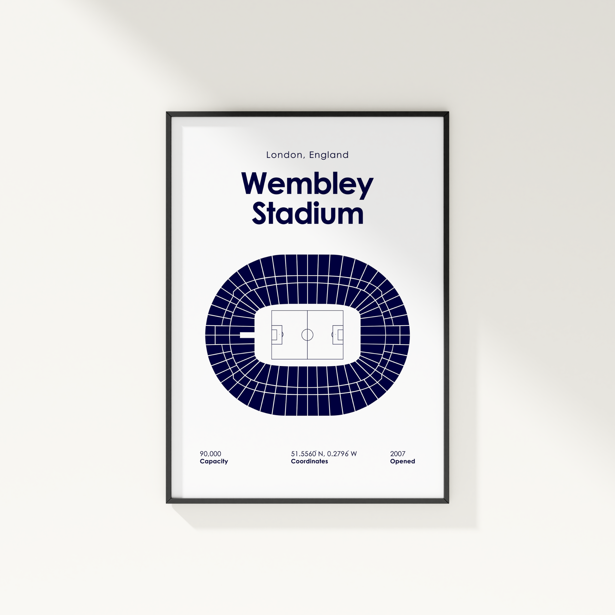 Framed poster of Wembley Stadium layout on a white wall