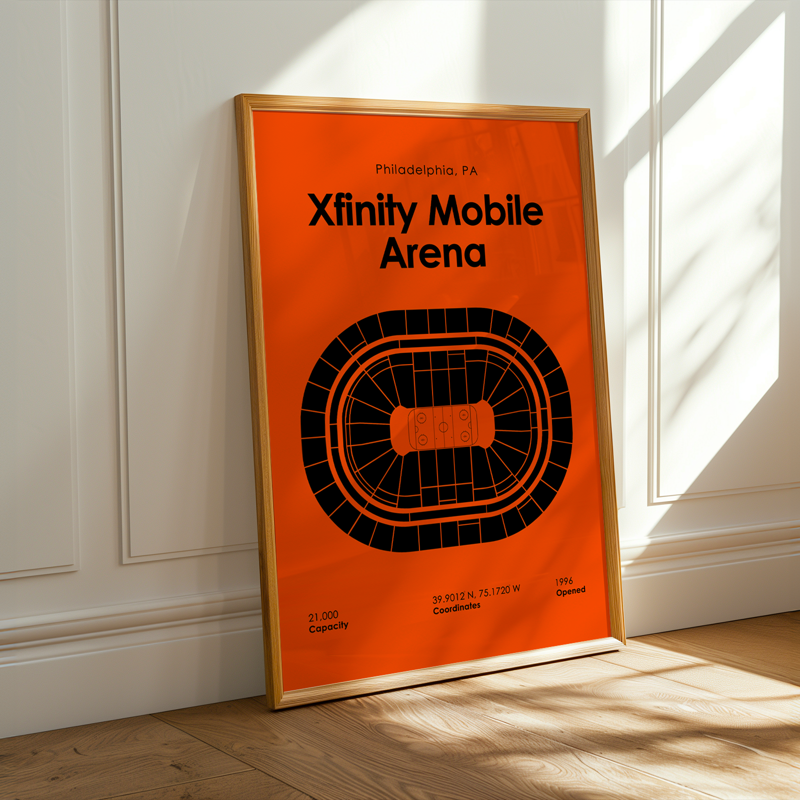 Framed poster of Xfinity Mobile Arena in Philadelphia, PA on an orange background.