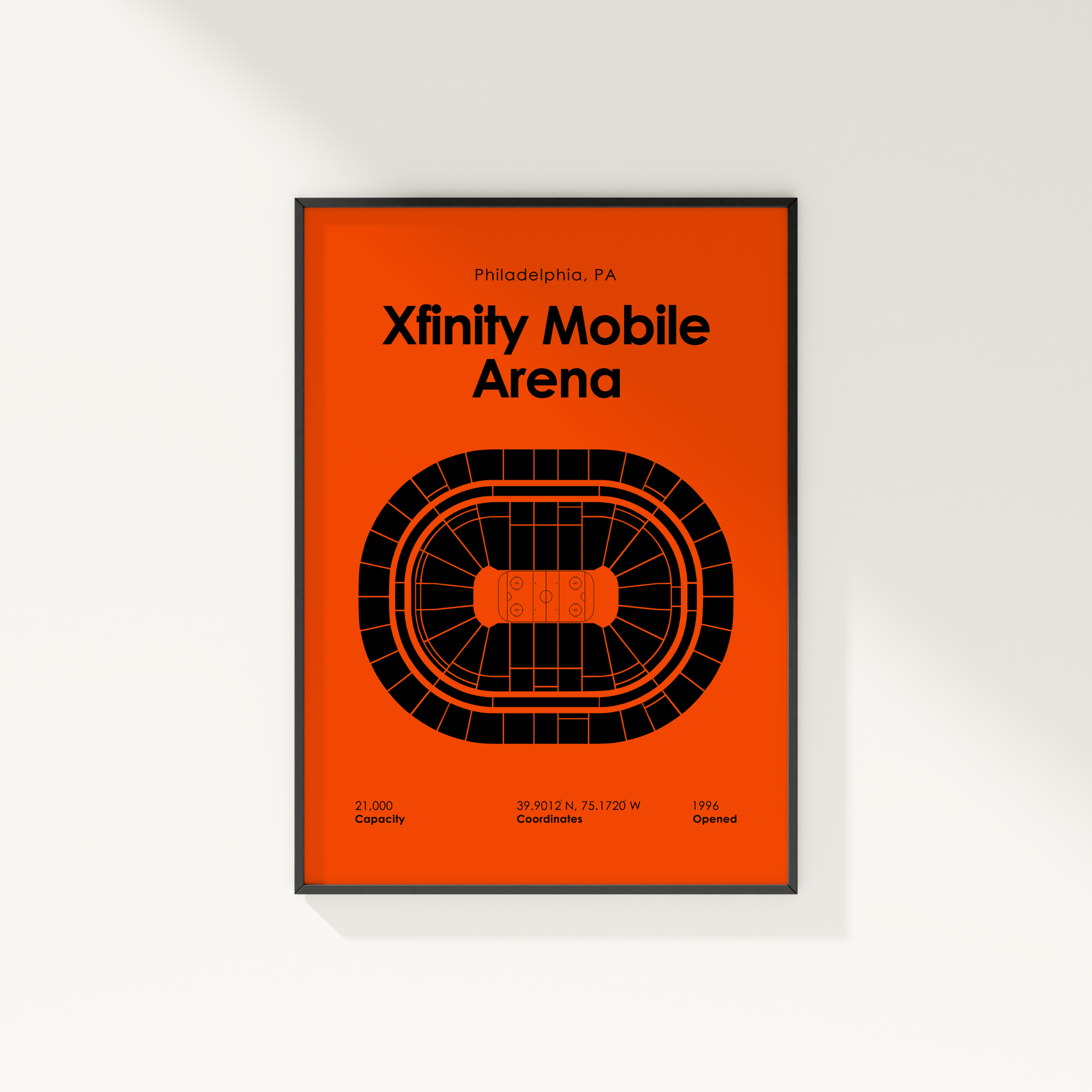 Framed poster of Xfinity Mobile Arena with orange background and black text.